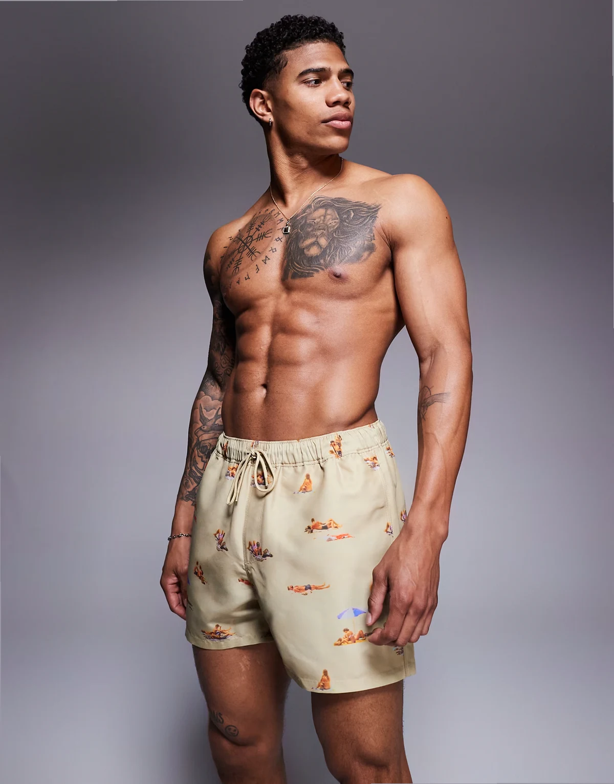 swim shorts in short length with beach print in stone
