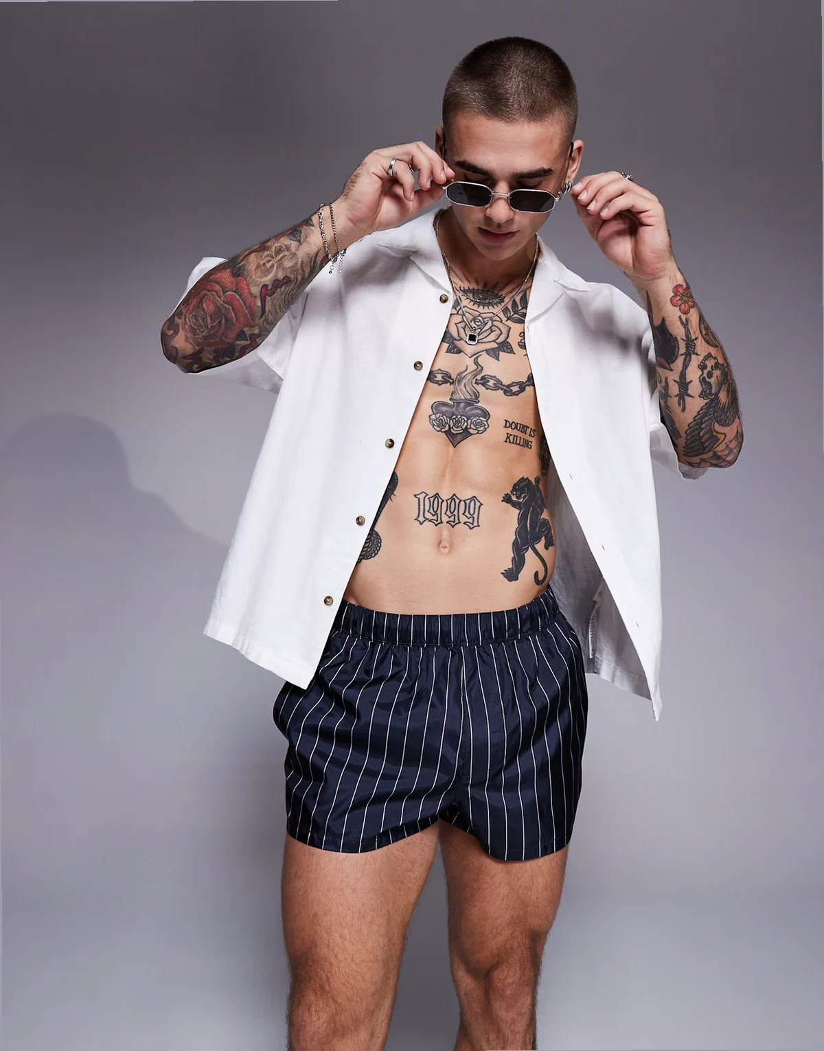 swim short in super short length in navy and white pin stripe