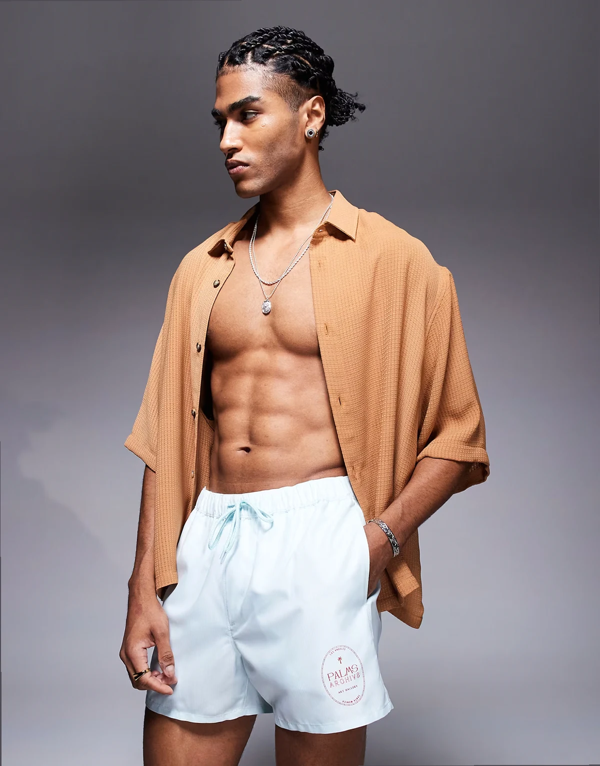 swim shorts in short length in blue and white stripe