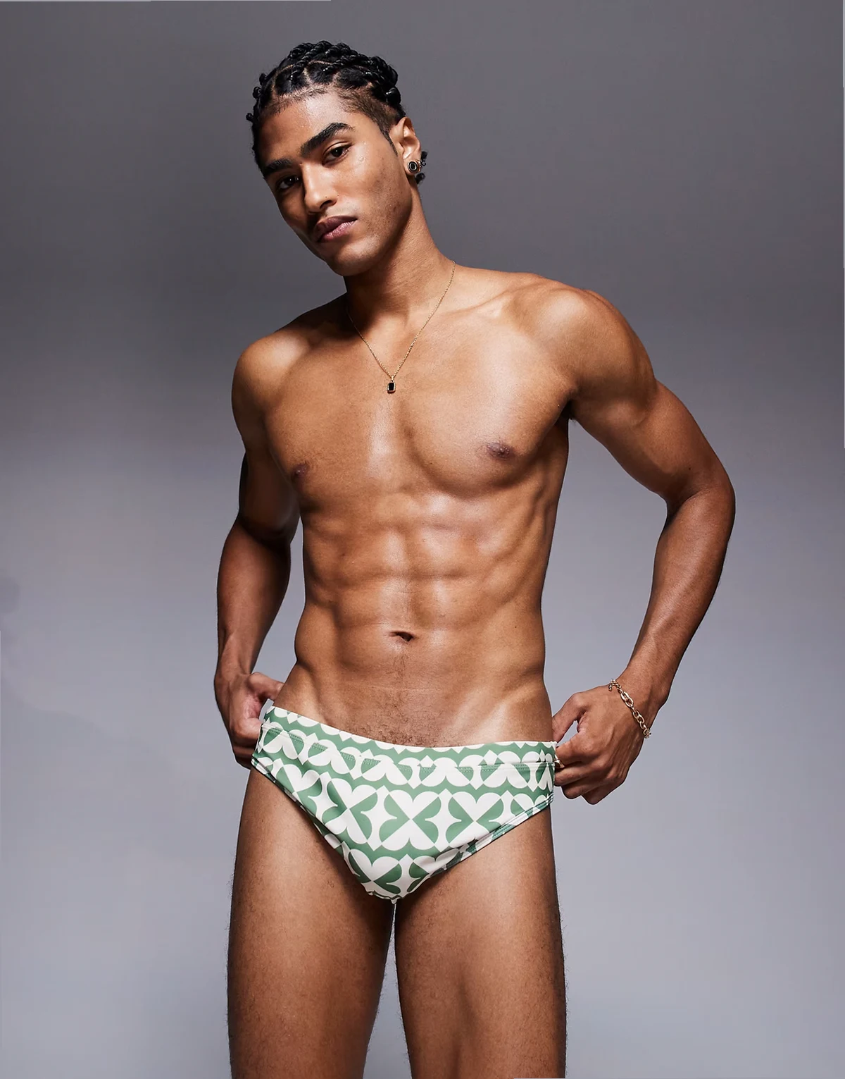 swim briefs in green and white geo print