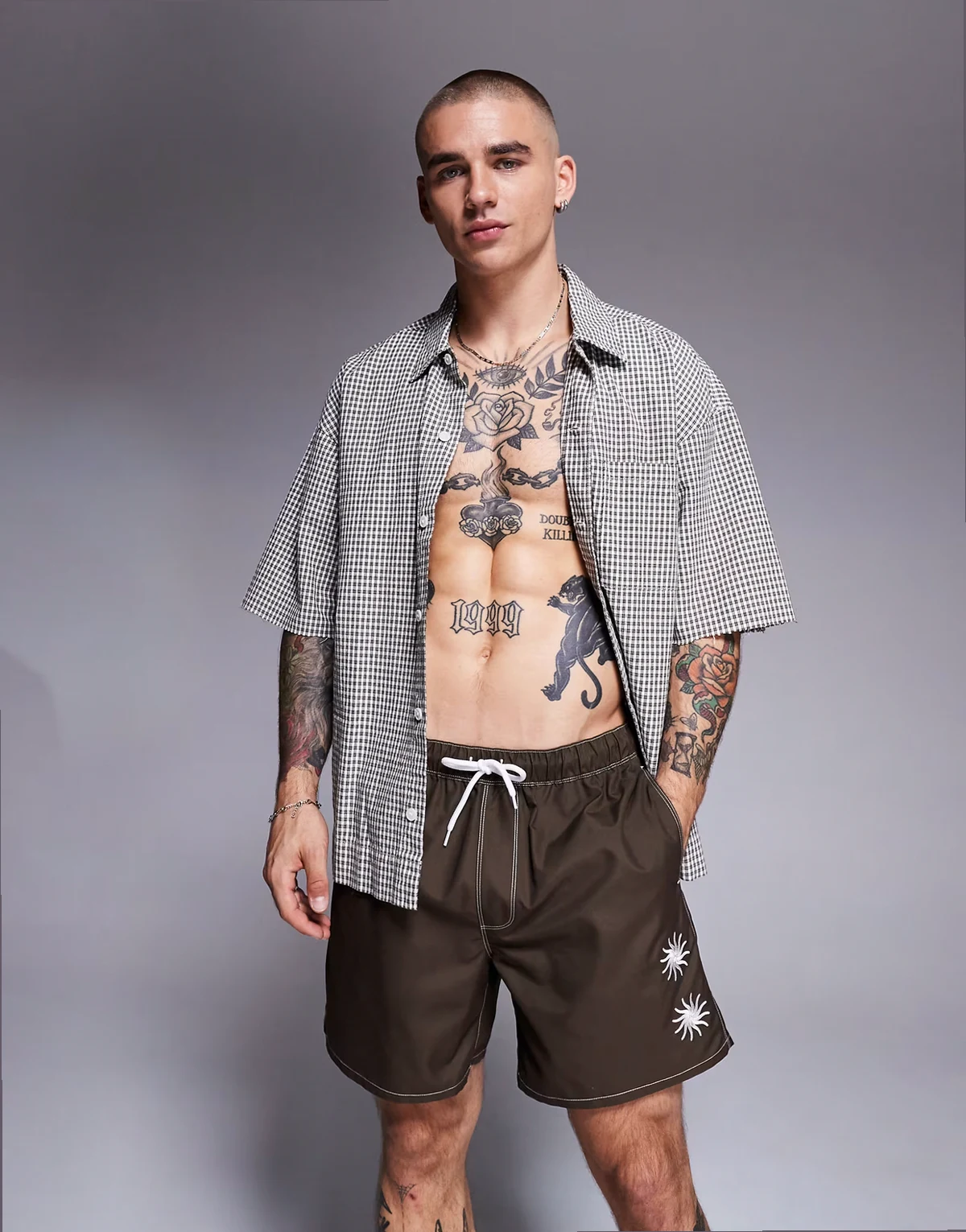 swim shorts in mid length with sun embroidery in brown