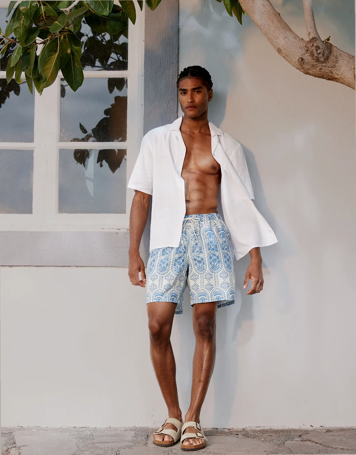 swim shorts in mid length with ornate floral in blue