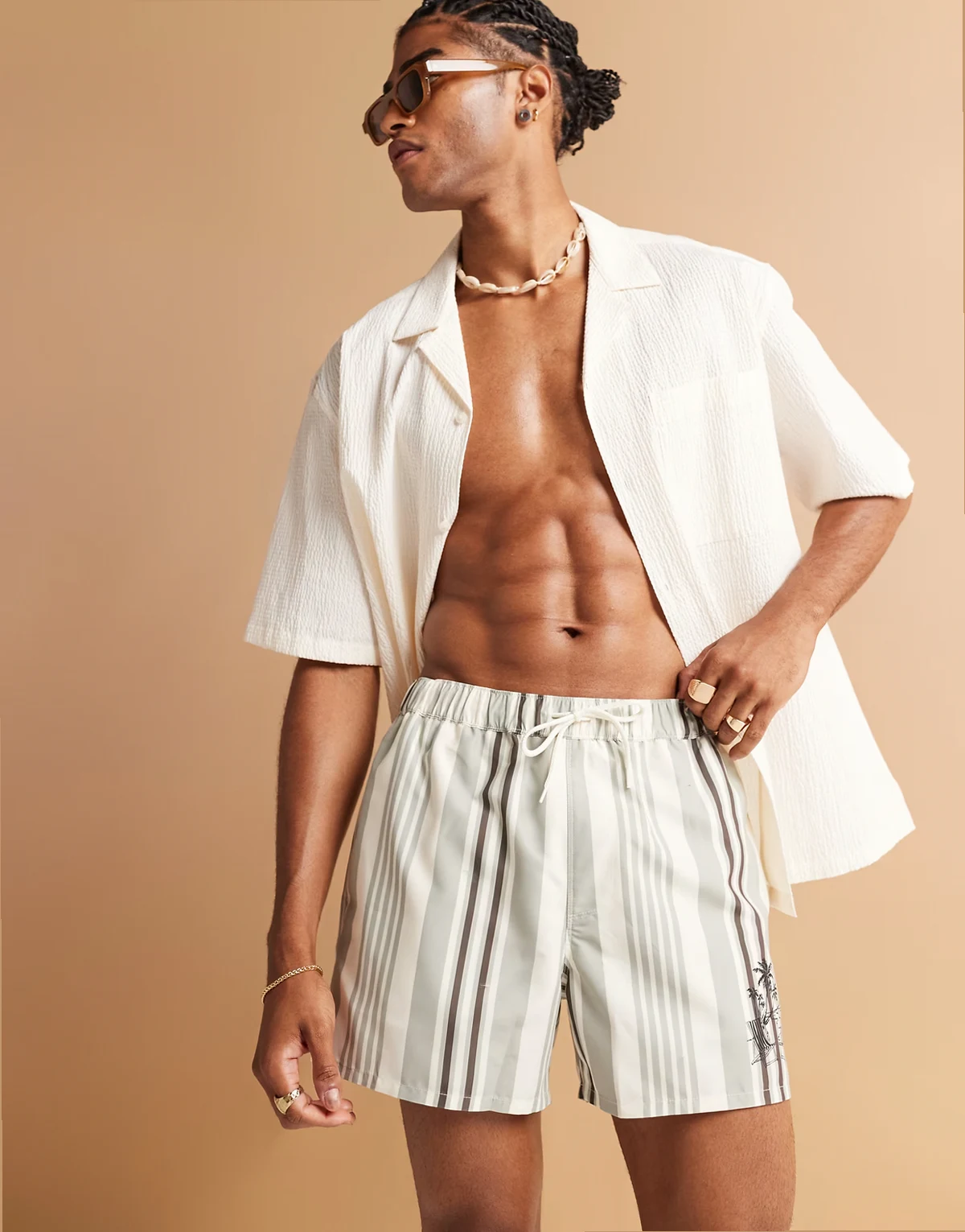 swim shorts in short length in cream stripe with placement print