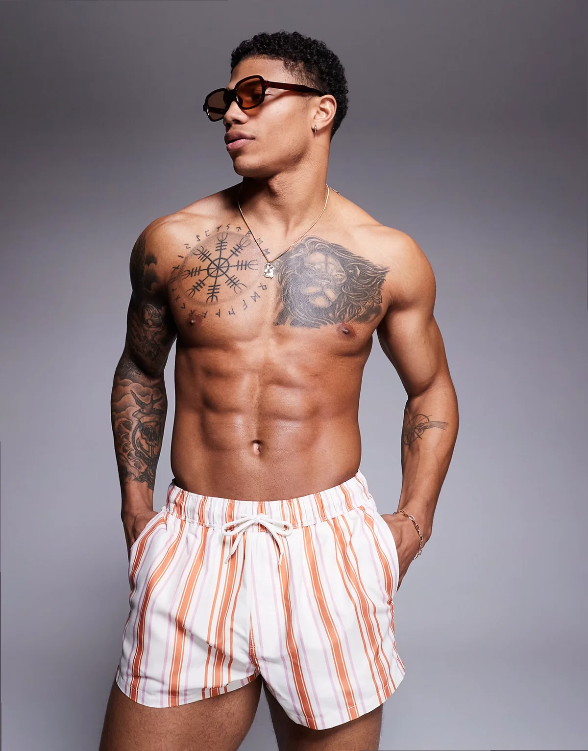 swim shorts in super-short length in white and orange stripe