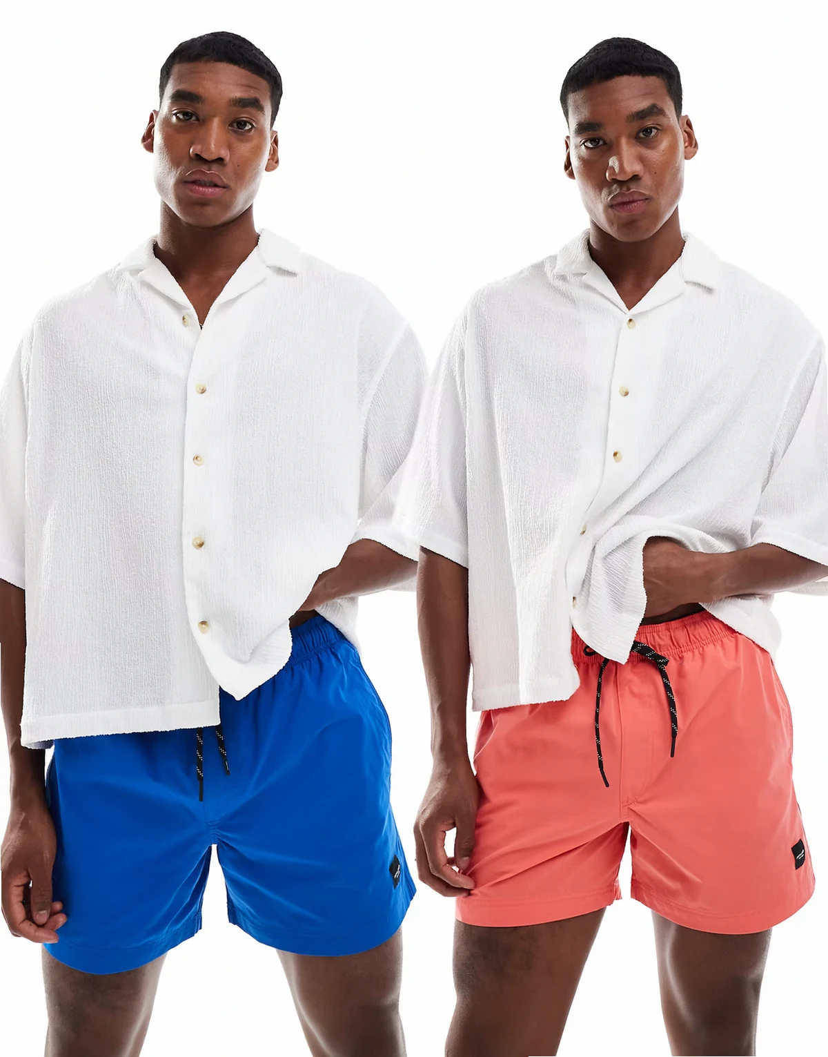 – Zestaw 2 par szortów kąpielowych w kolorze różowym i niebieskim