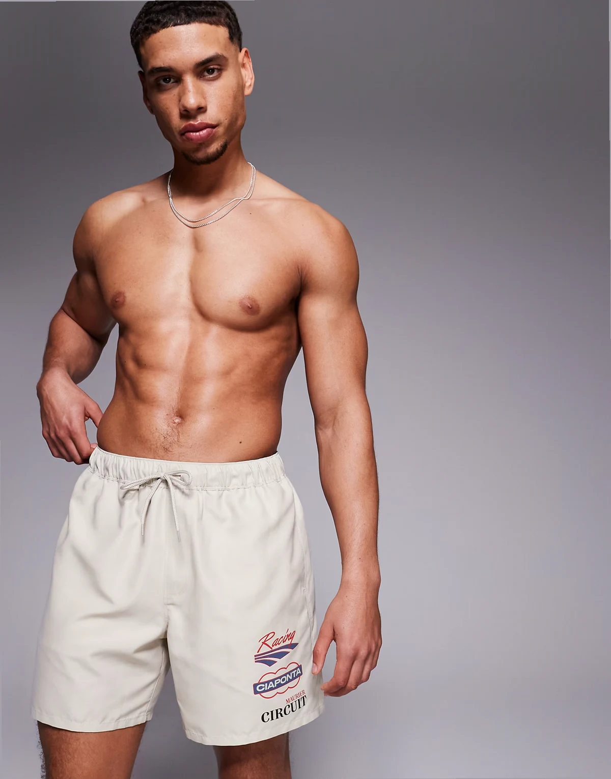 swim shorts in mid length with placement print in beige