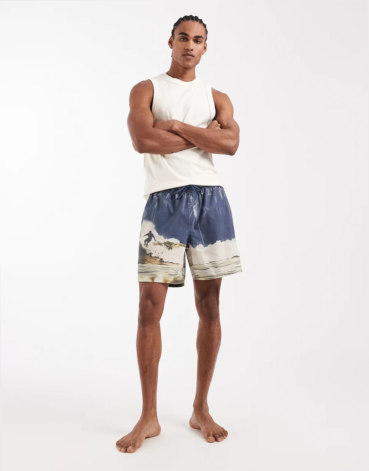 swim shorts in mid length with surfer print in blue