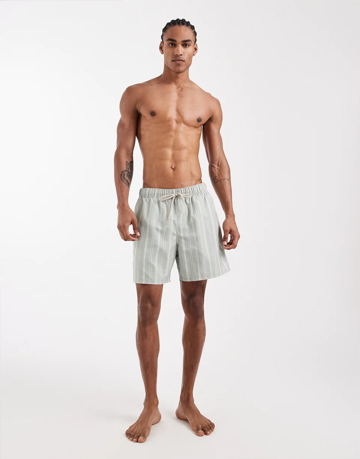 swim shorts in mid length in sage green stripe