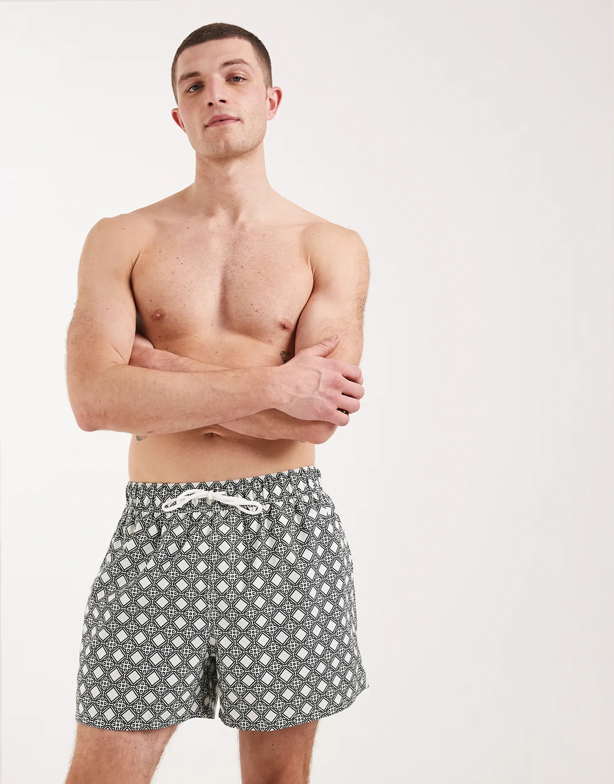 swimsuit in short length with green geo print