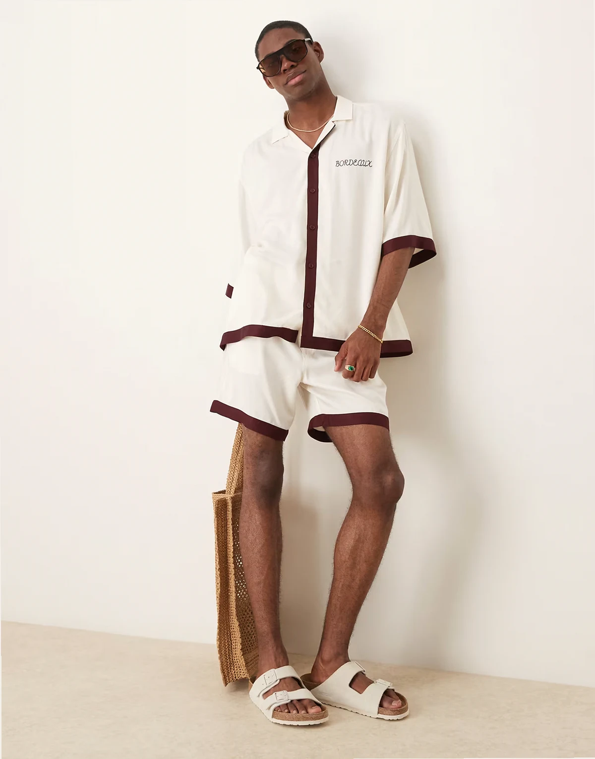 shorts in mid length with border print in beige - part of a set