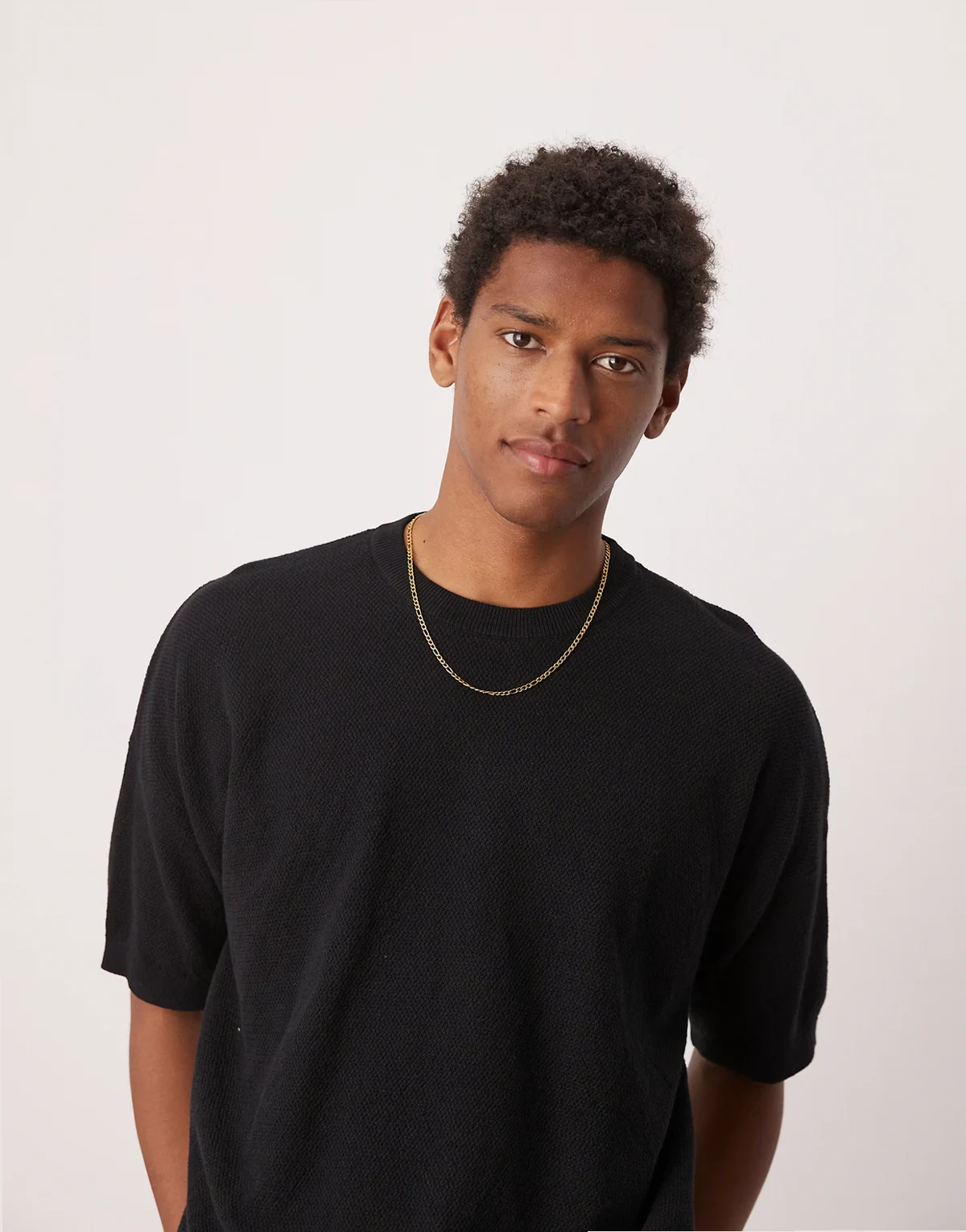 – Gestricktes Oversize-T-Shirt in Schwarz mit Pikee-Struktur