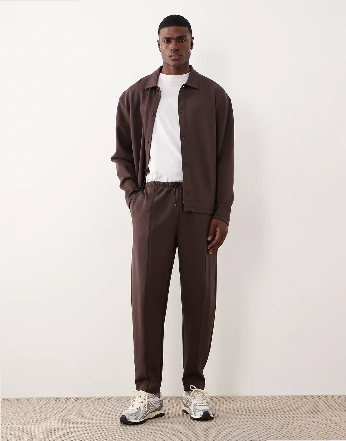 tapered sweatpants with pintucks in brown