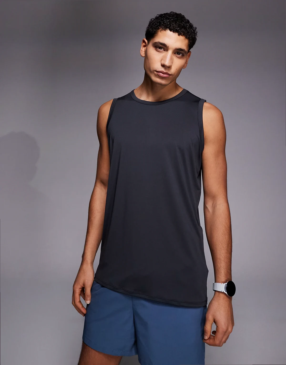 Icon training sleeveless loose fit tank with quick dry in charcoal
