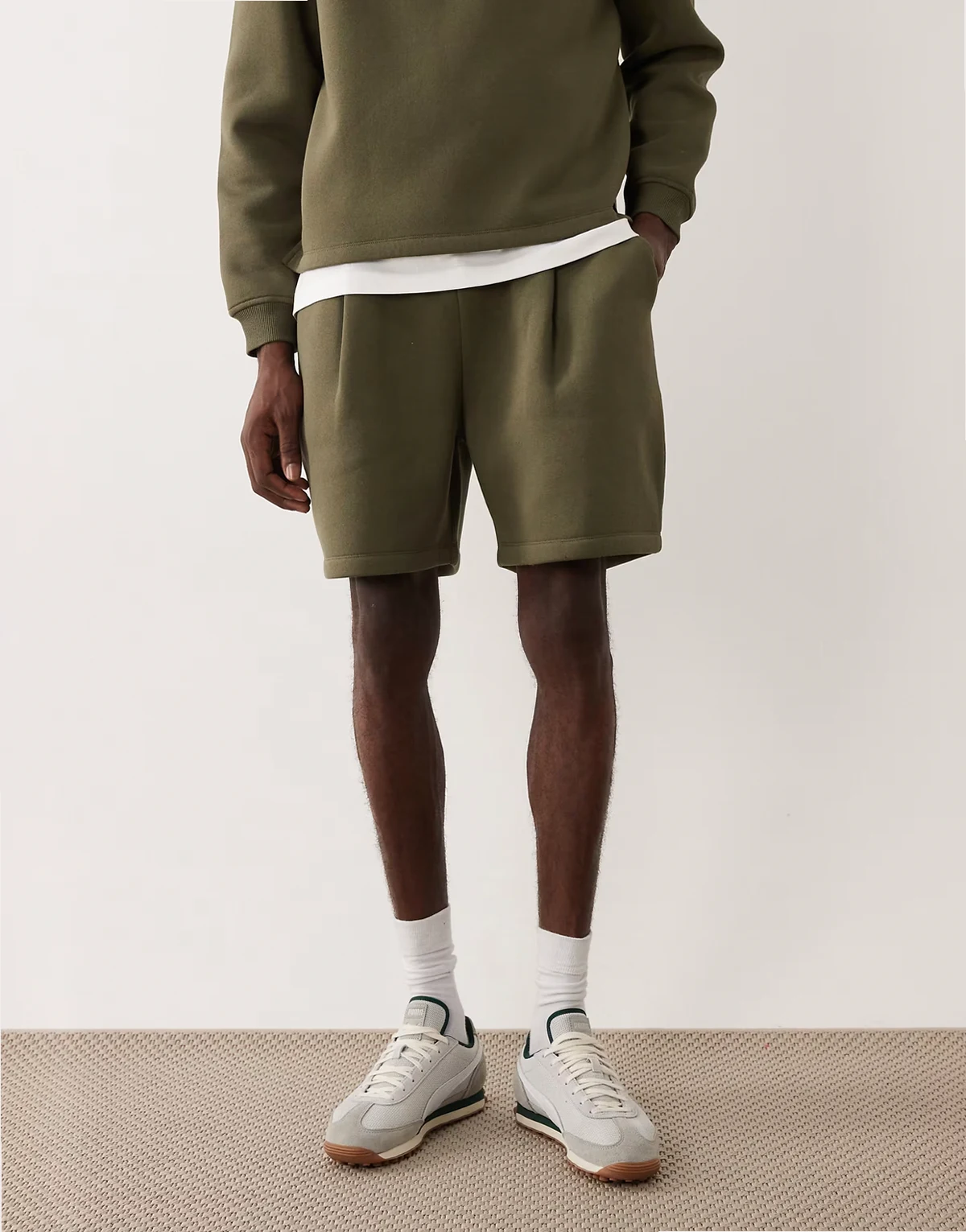 oversized pleated shorts in green - part of a set