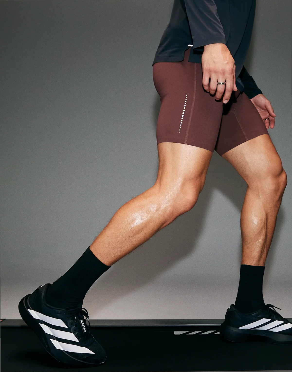 Premium reflective running half tights with phone pocket and bonded hems in deep mahogany