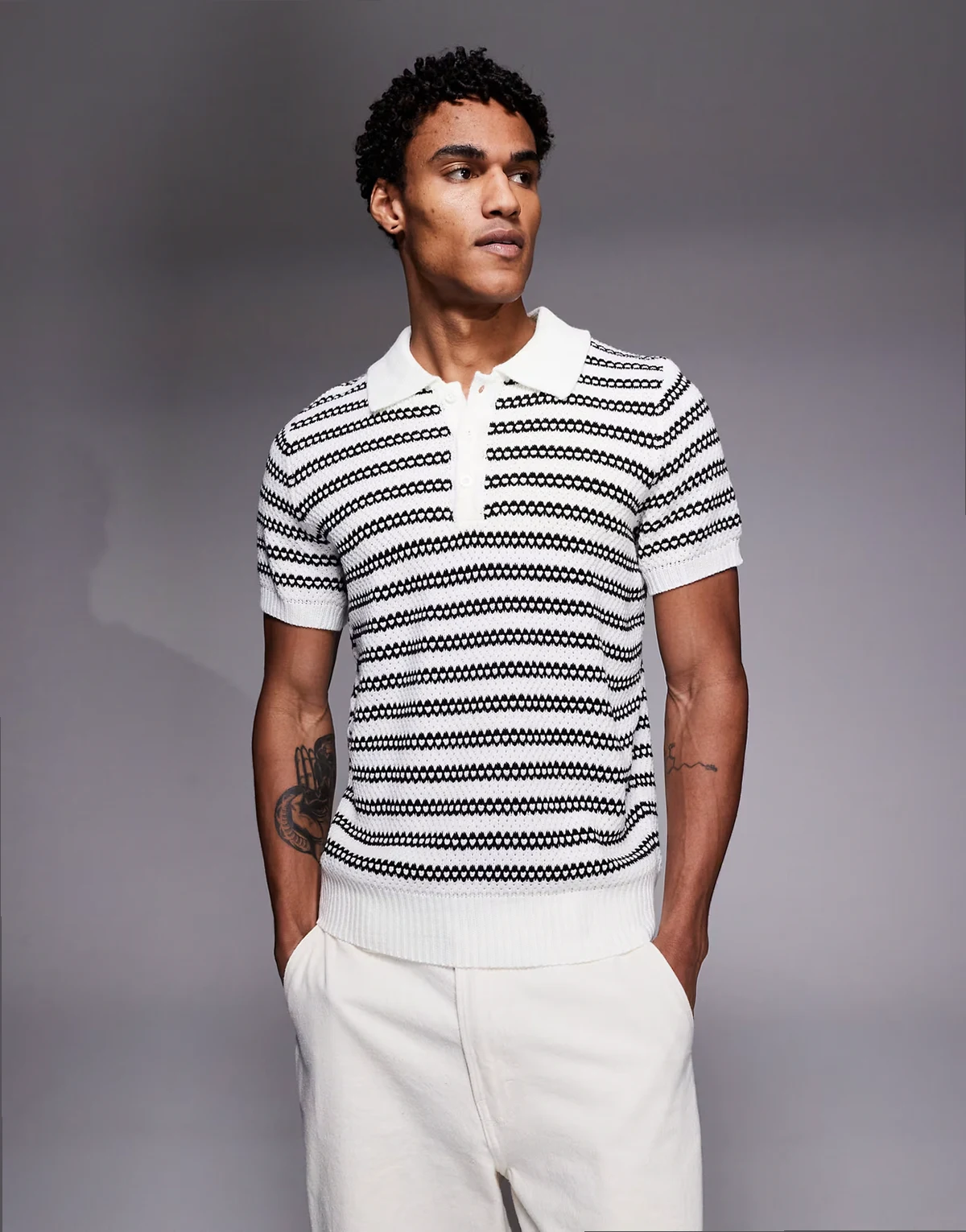 knit polo top in black stripes