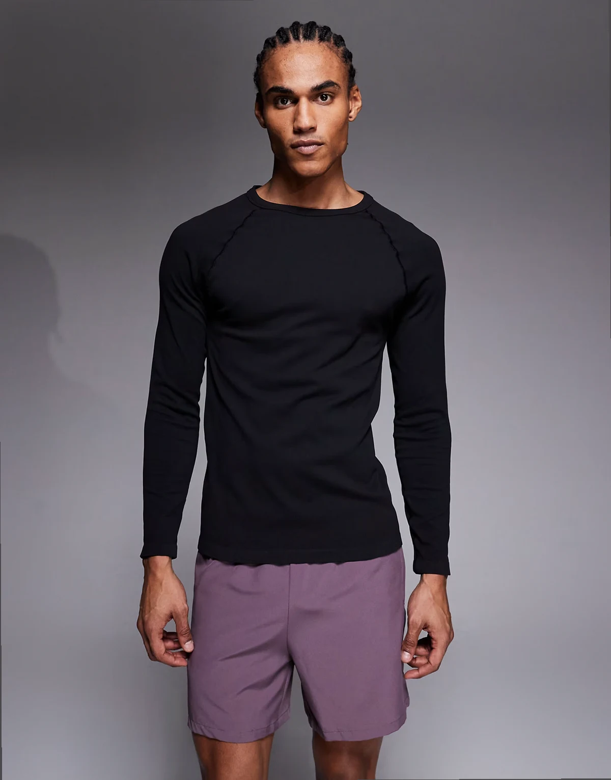 seamless ribbed slim fit long sleeve raglan top in black