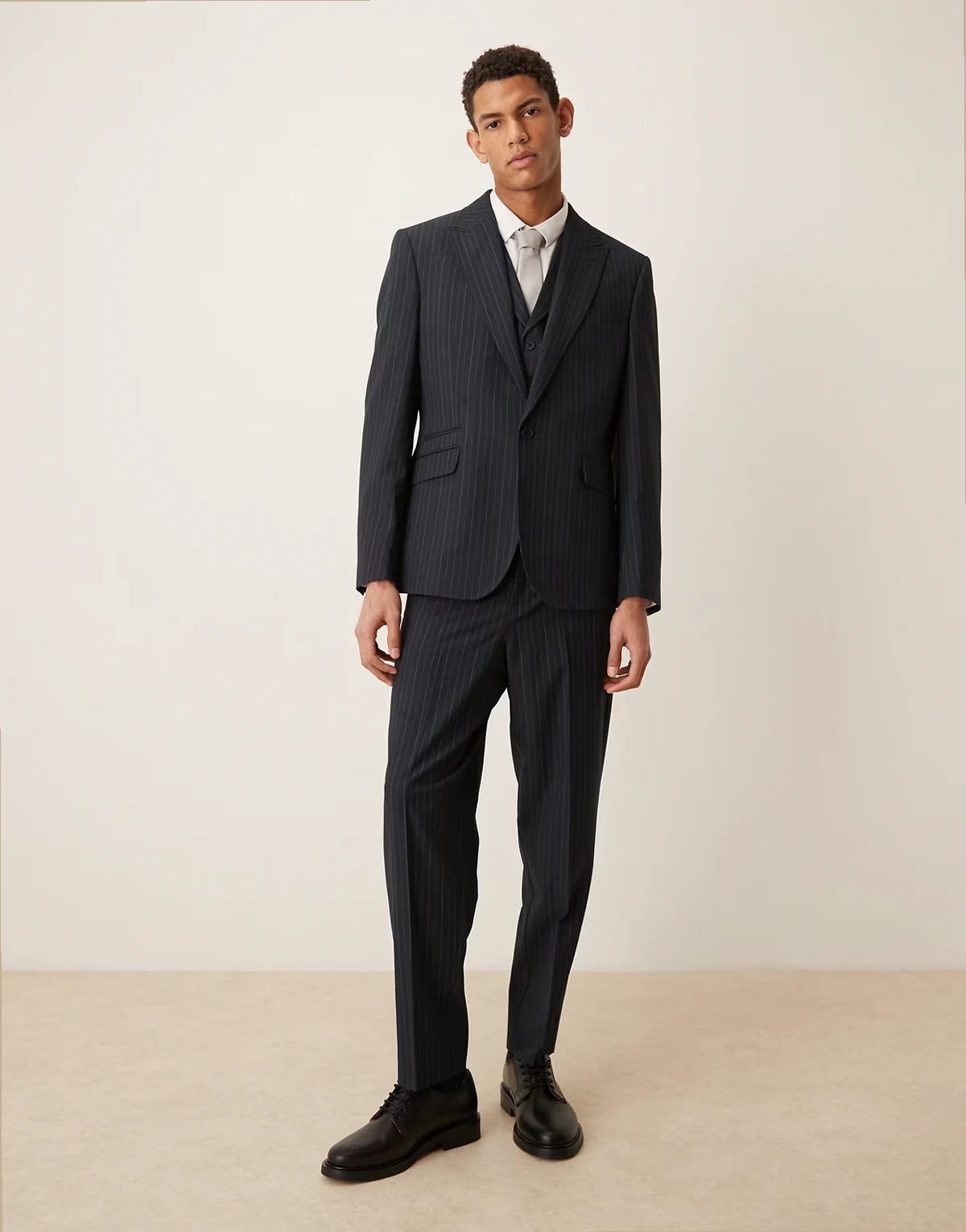 relaxed tapered suit pants in navy pinstripes