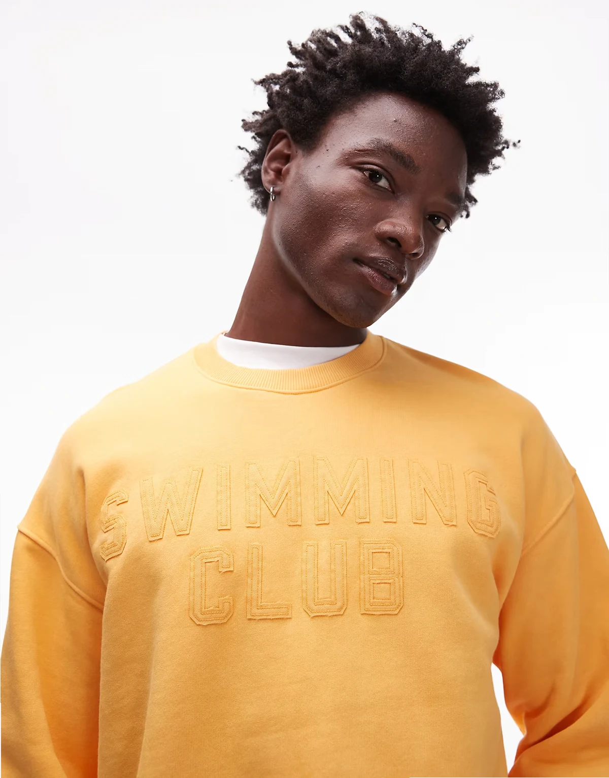 – Oversize-Sweatshirt in verwaschenem Orange mit „Swimming Club"-Stickerei