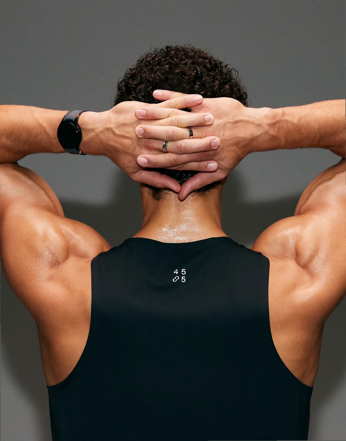 Premium perforated lightweight running tank top with bonded hems and reflective detailing in void black