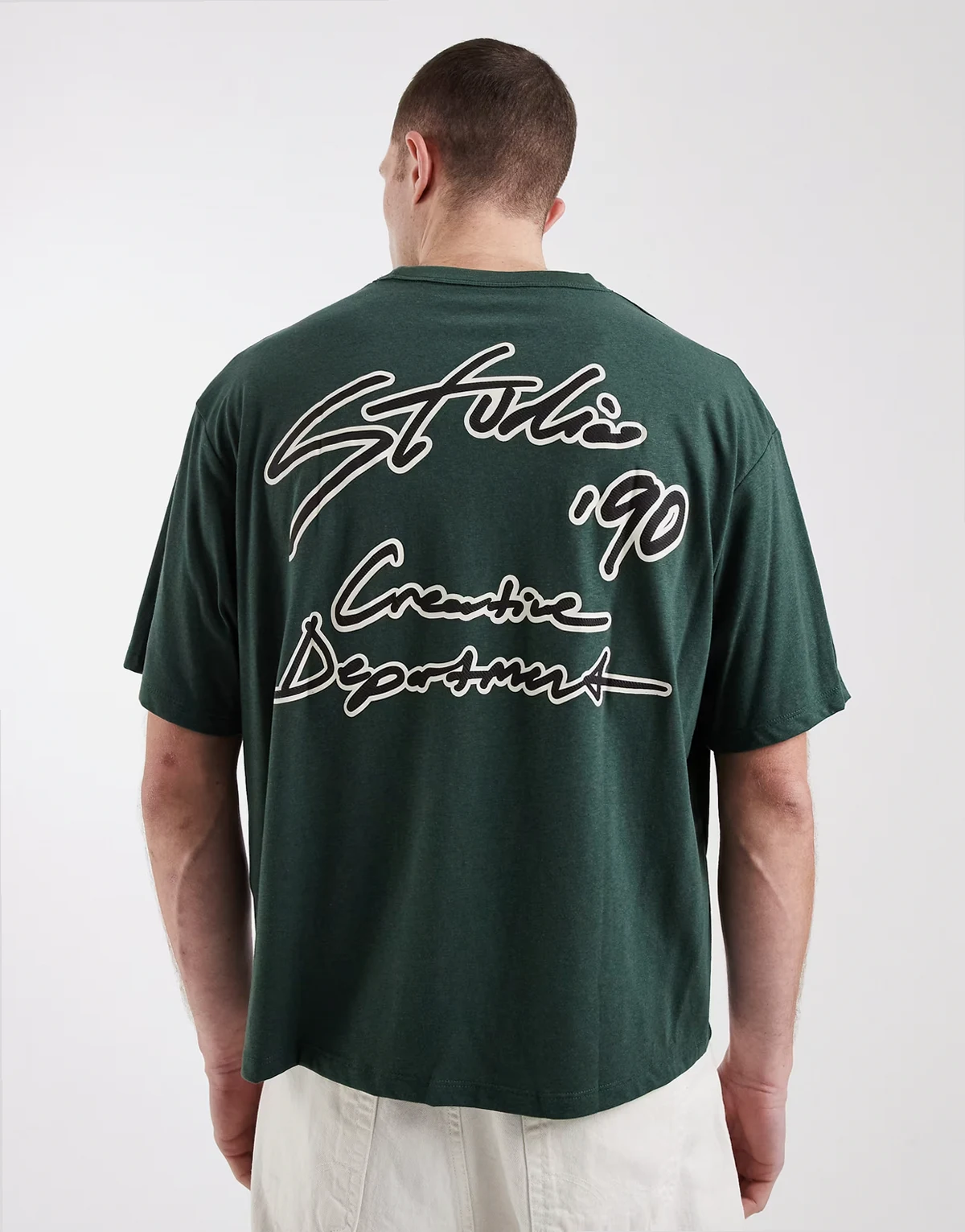 – Zielony T-shirt o pudełkowym kroju z nadrukiem „Studio” na plecach