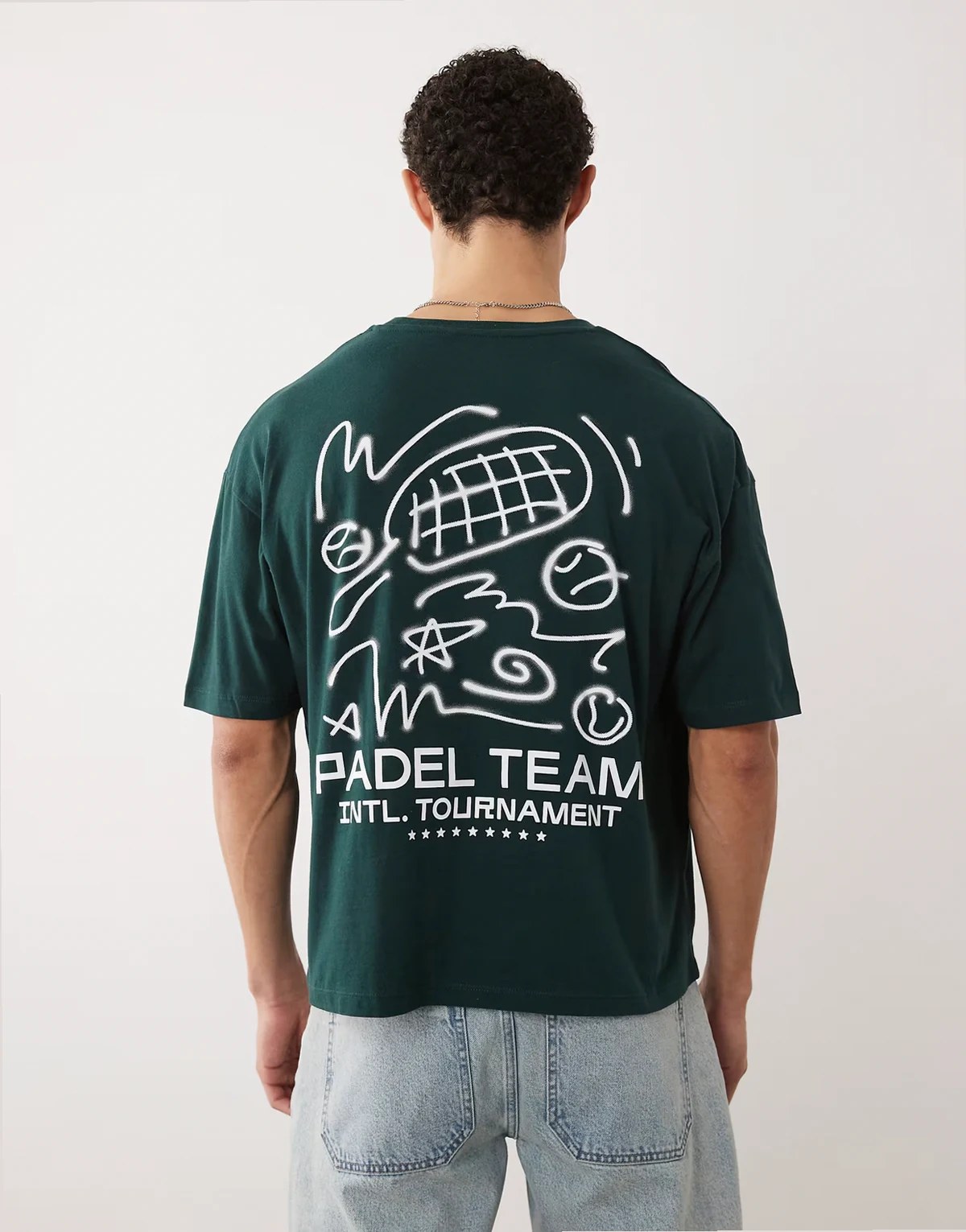 – Ciemnozielony T-shirt oversize o pudełkowym kroju z grafiką z rakietkami