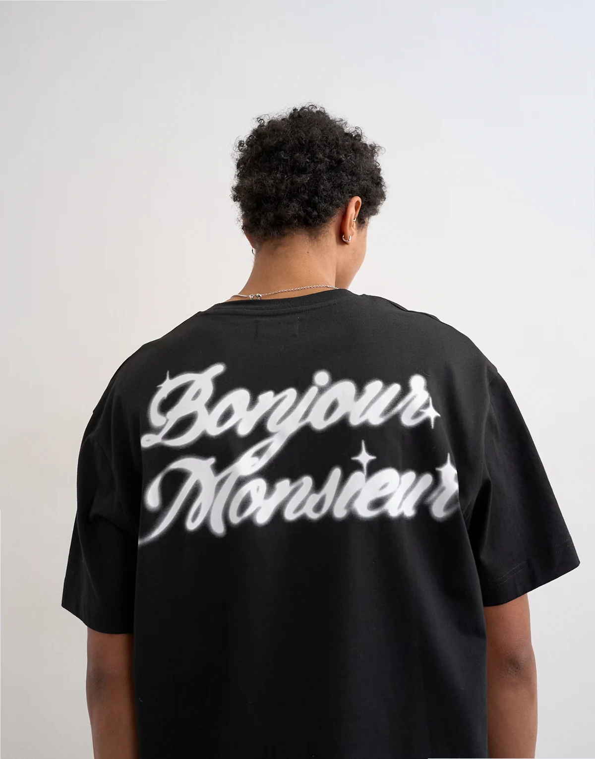 – Relaxed-Fit-T-Shirt in Schwarz mit „Bonjour“-Print