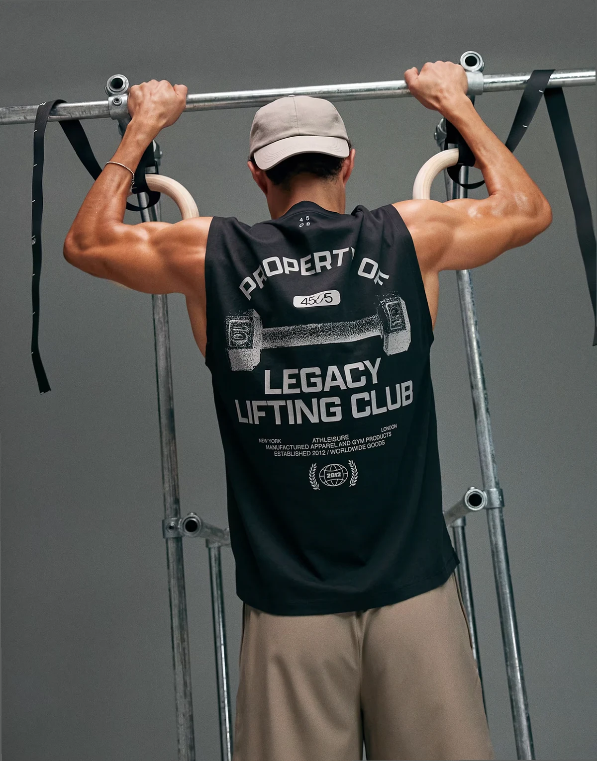 cotton oversized pump training tank with back graphic and quick dry finish in washed black