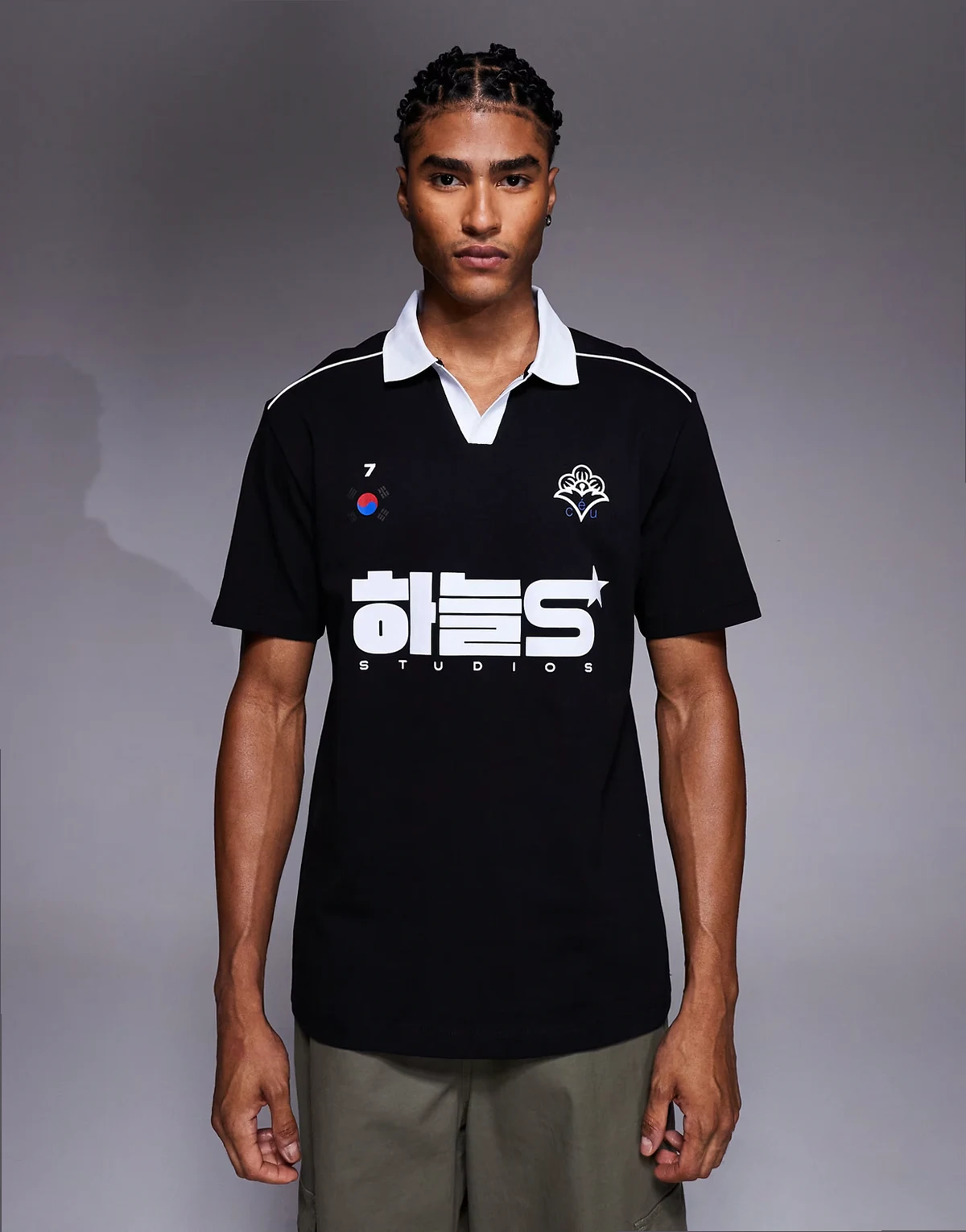 relaxed polo with piping detail and sports graphic in black