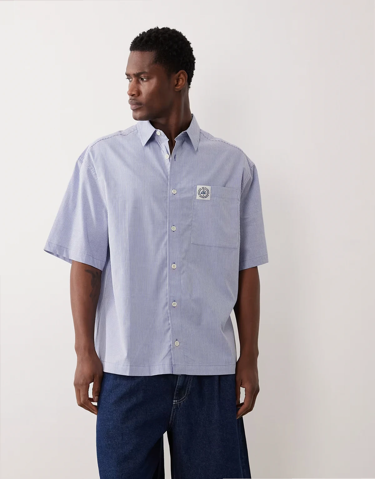 oversized striped shirt with chest badge in blue