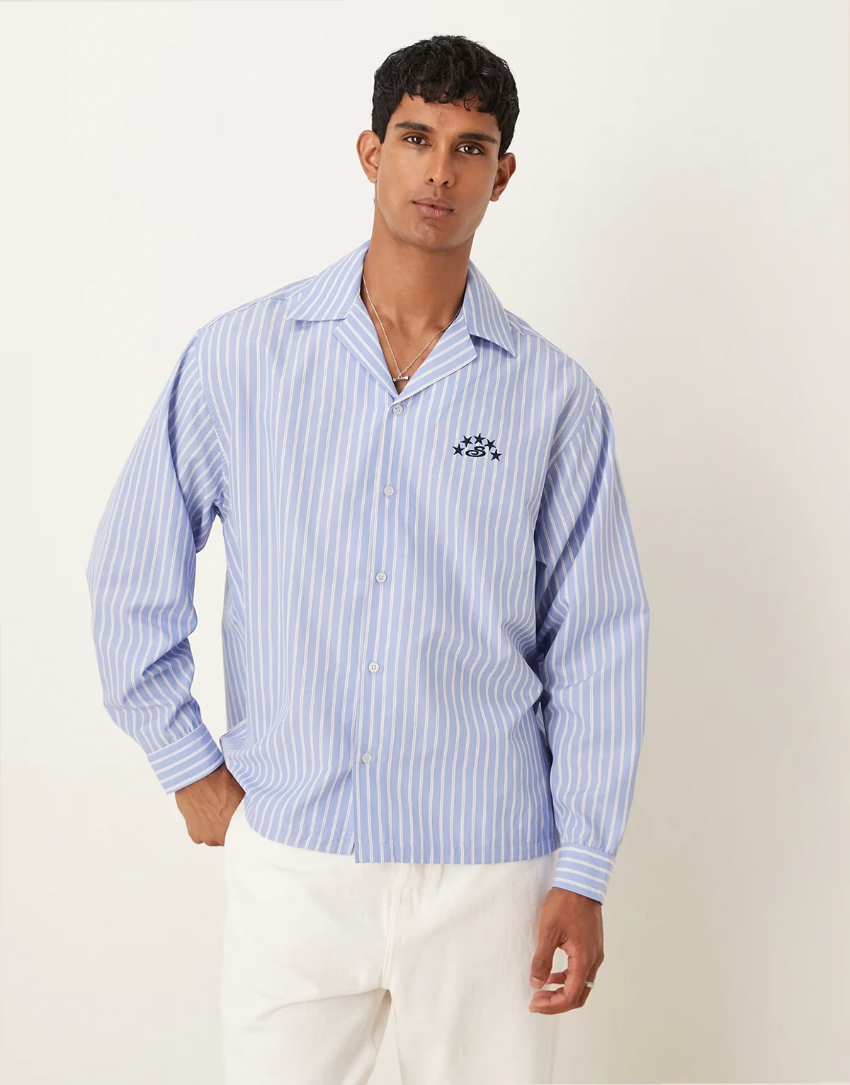 long sleeved oversized fit shirt with embroidery detail in blue and white stripe cotton