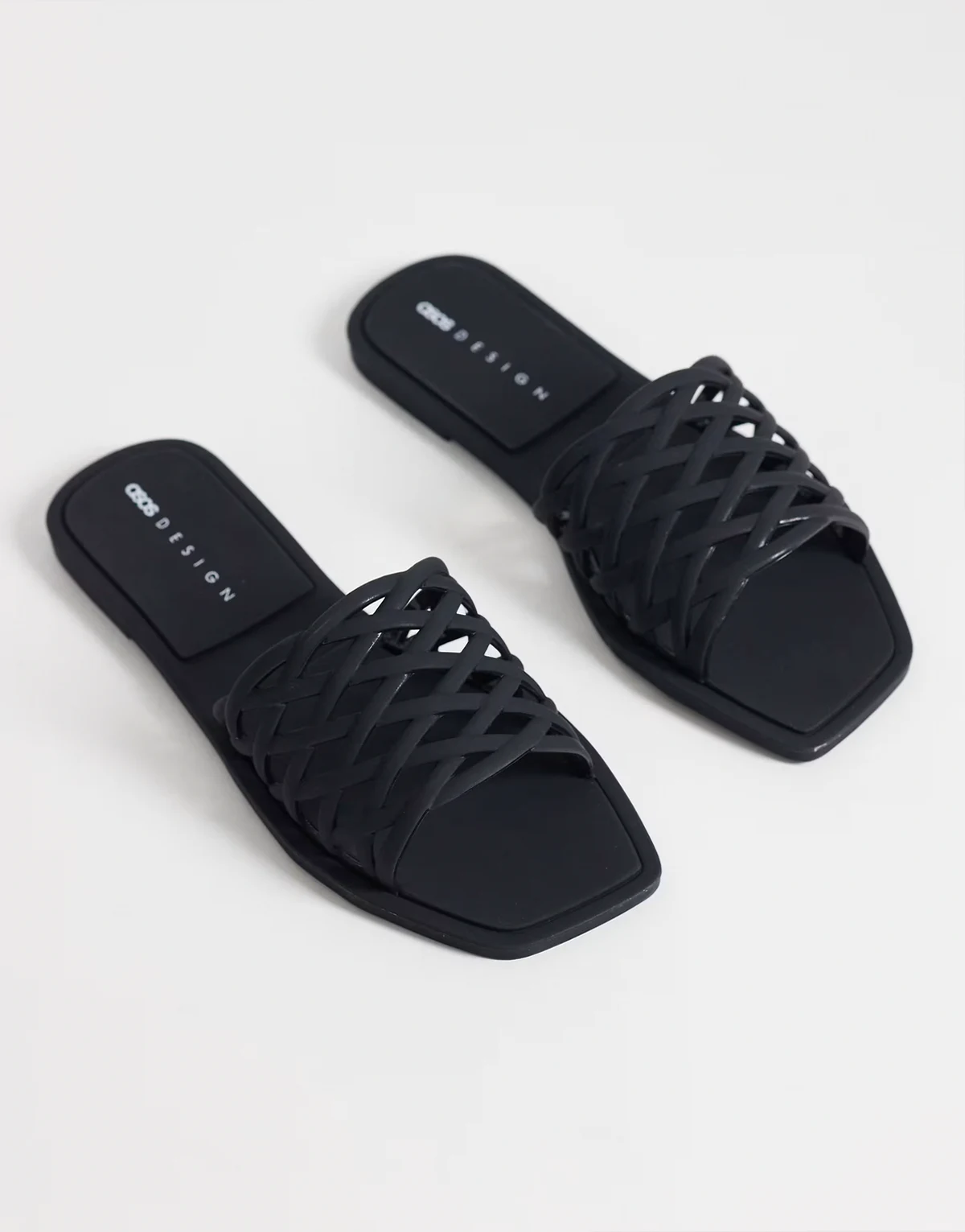 Faris woven jelly flat mules in black