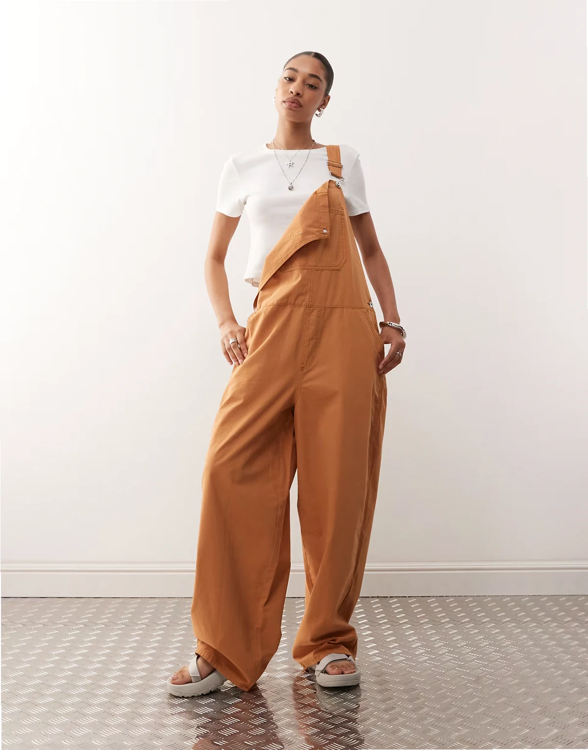 denim overalls in brown