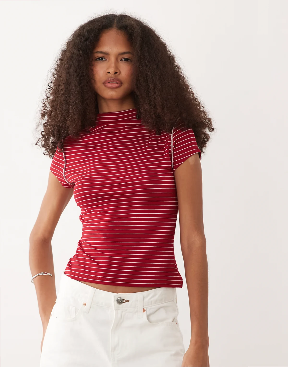 ribbed funnel neck top with exposed seams in red and white