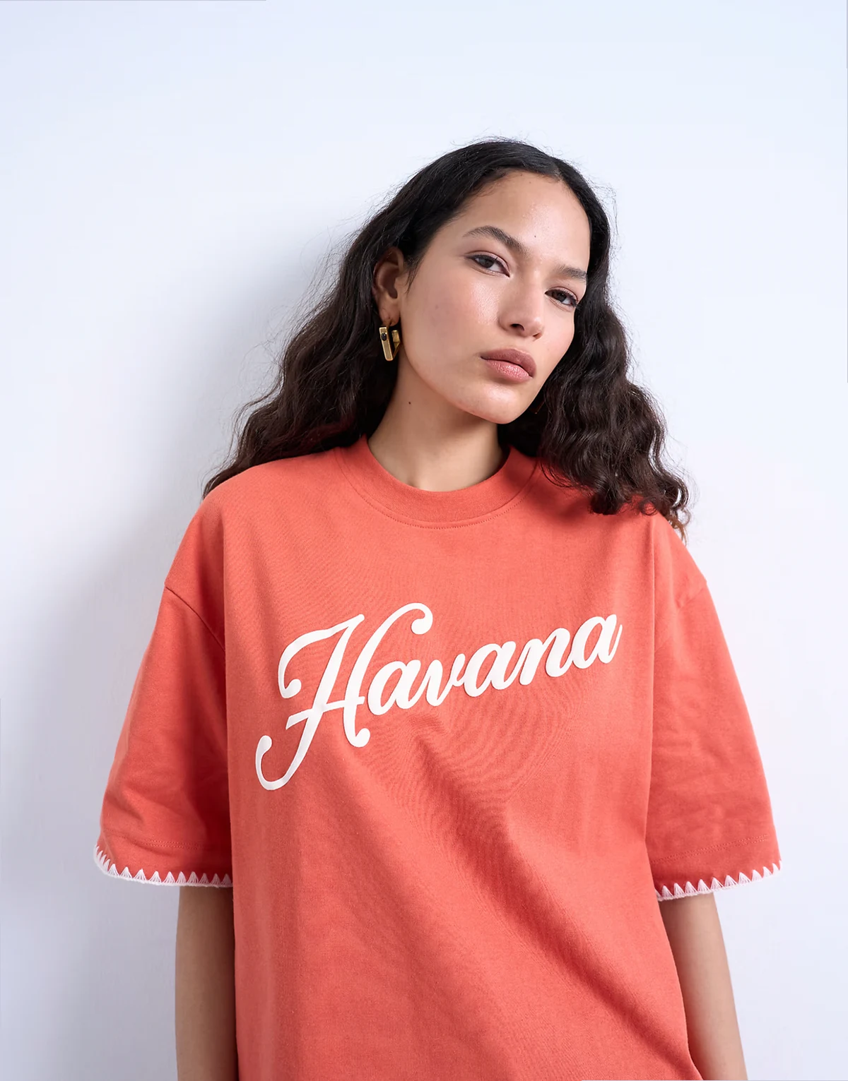 – Oversize-T-Shirt in Orange mit „Havana“-Grafikprint und Überwendlichstich