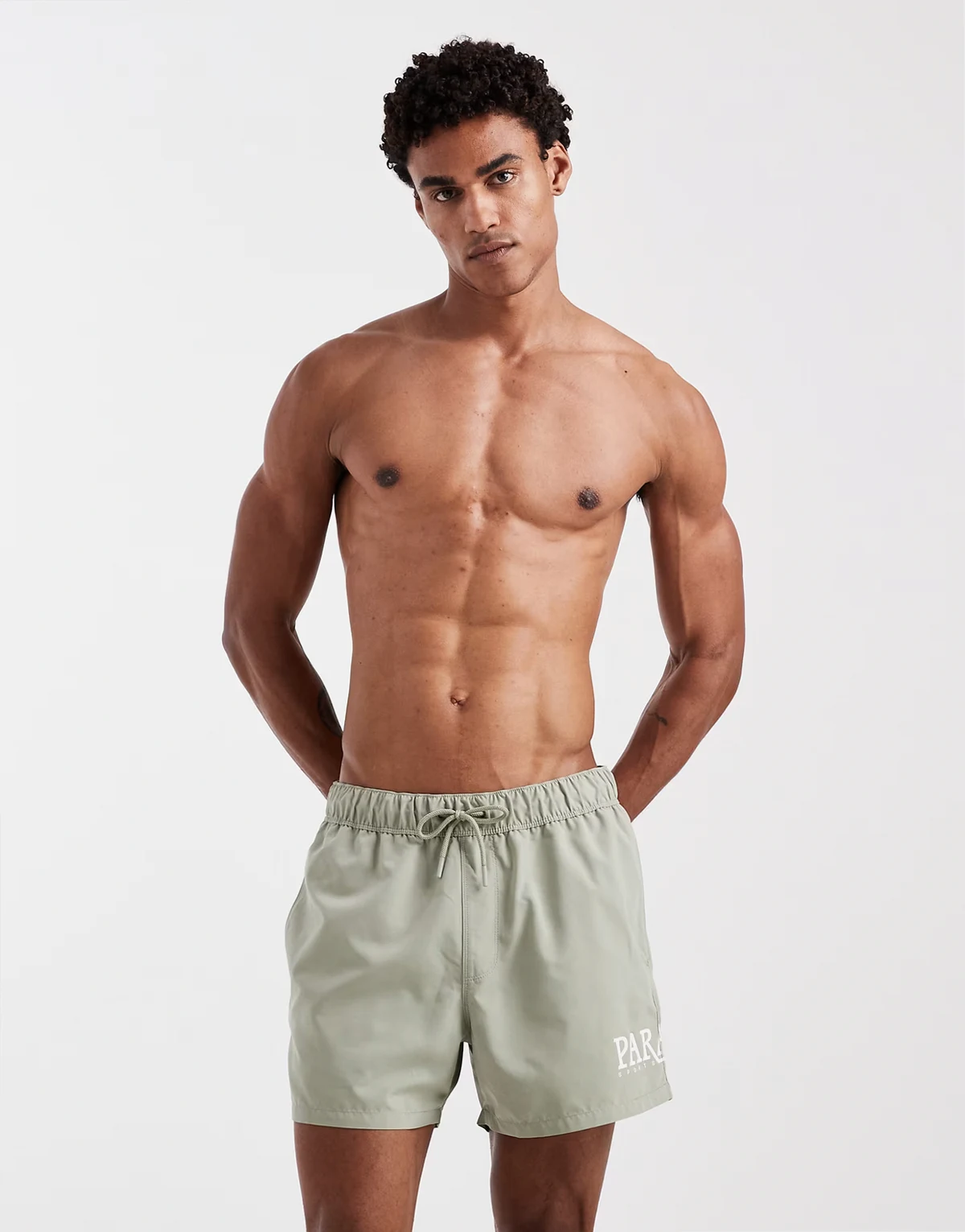 swim shorts in short length with placement print in sage green