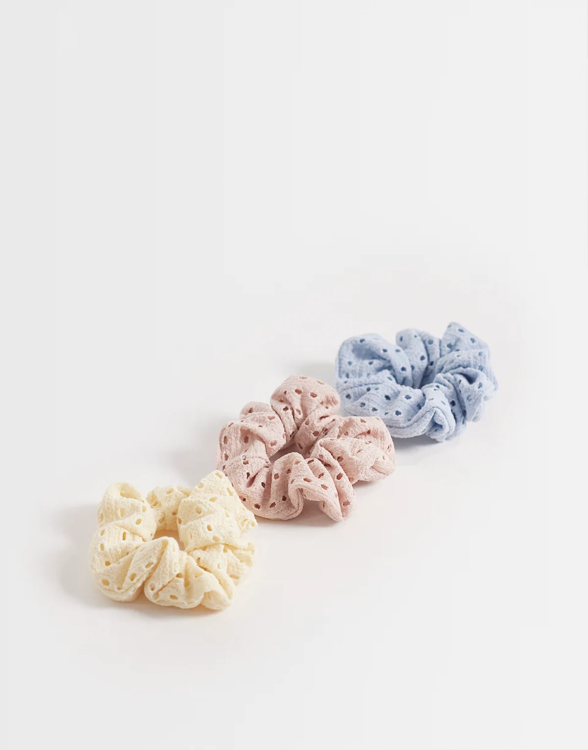 3-pack eyelet scrunchies in light blue, pink & yellow