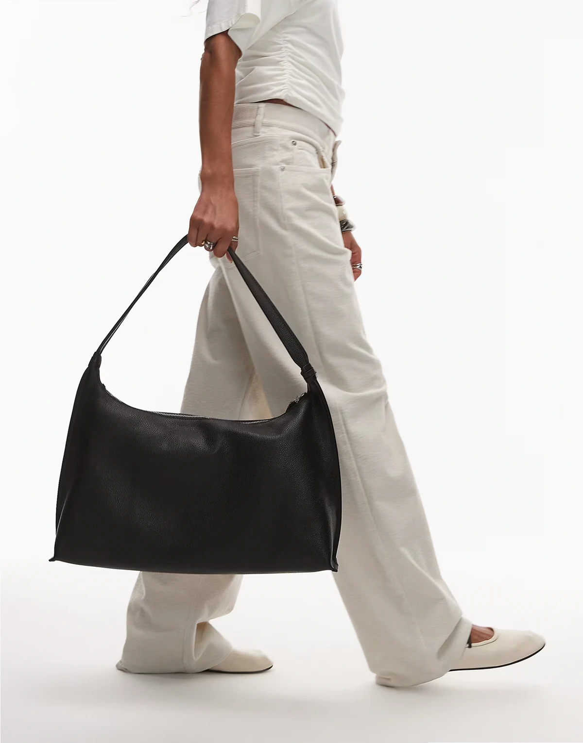 leather curved shoulder bag in black