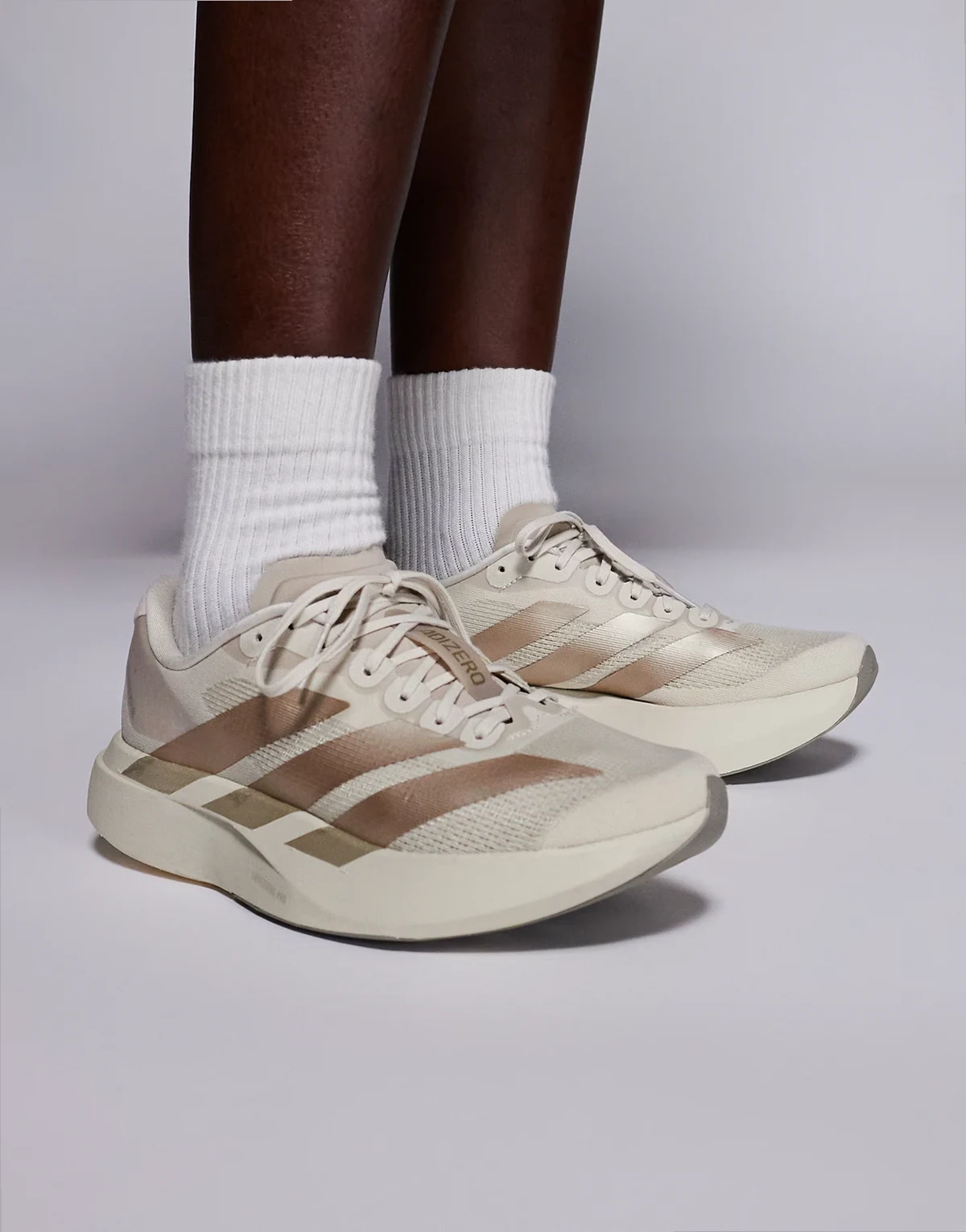 adidas Running Adizero Evo SL sneakers in off-white and gold