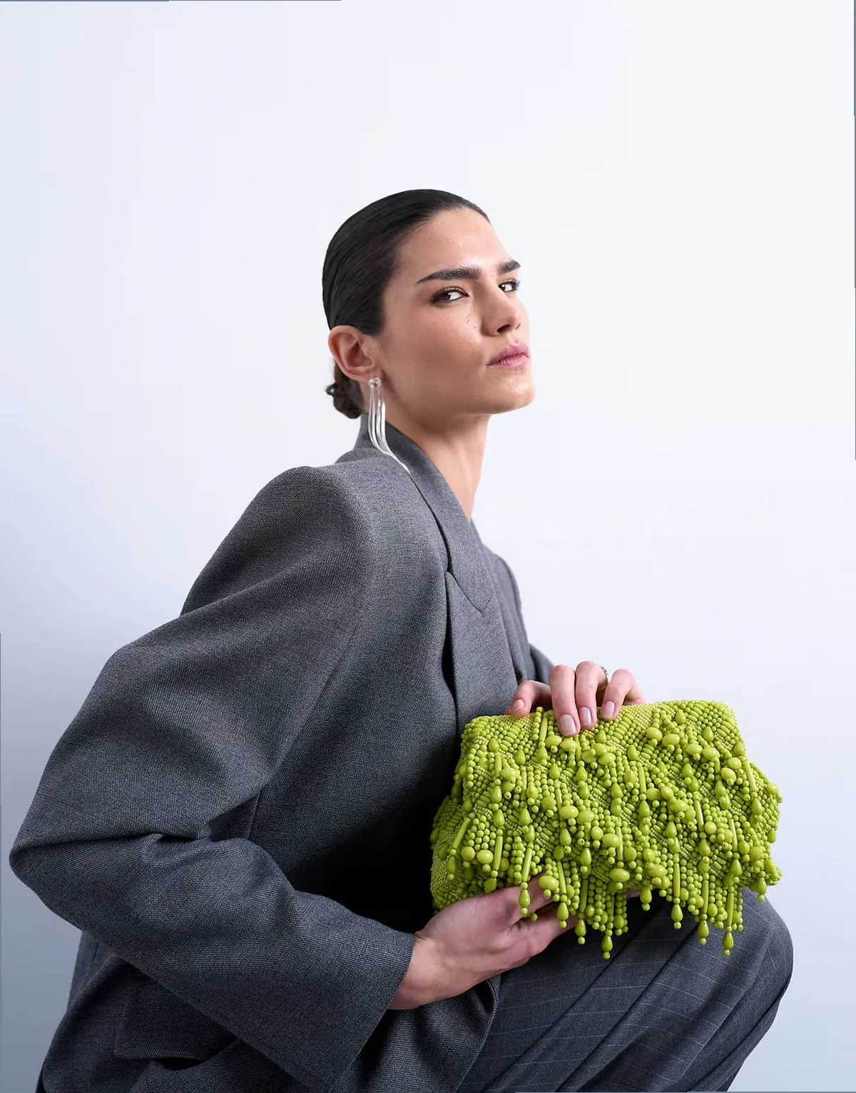 Garison bead and embellished clutch in green