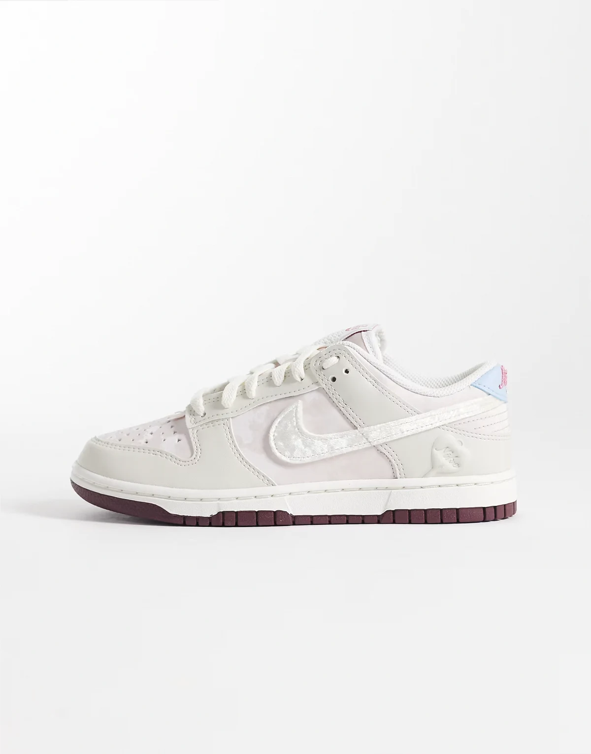 Dunk Low sneakers in off white and burgundy with velvet and bow details