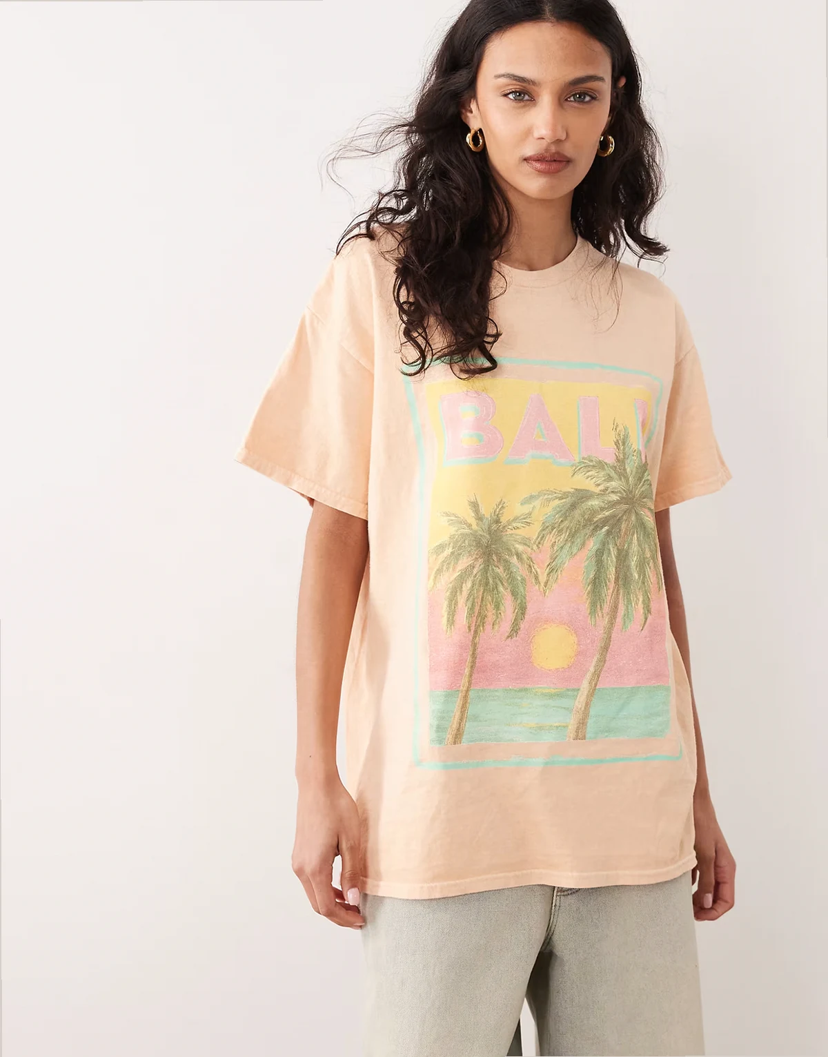 – Oversize-T-Shirt in Pfirsich mit „Bali“-Strandprint