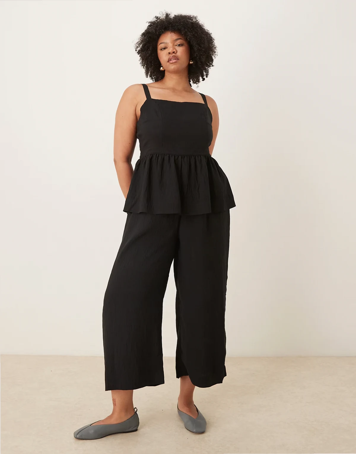 ASOS DESIGN Curve jumpsuit with peplum waist in black