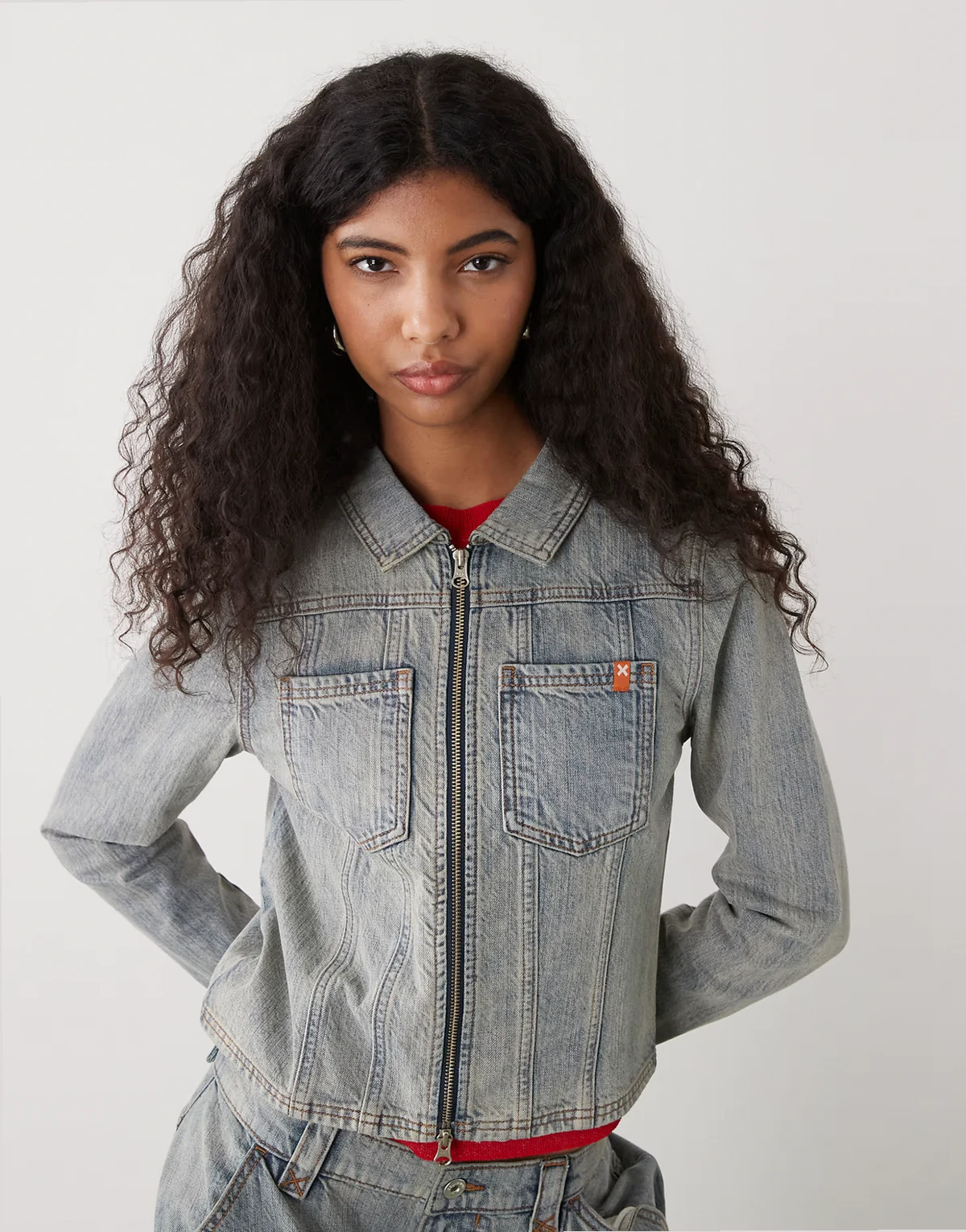 fitted denim jacket with double ended zipper in light wash