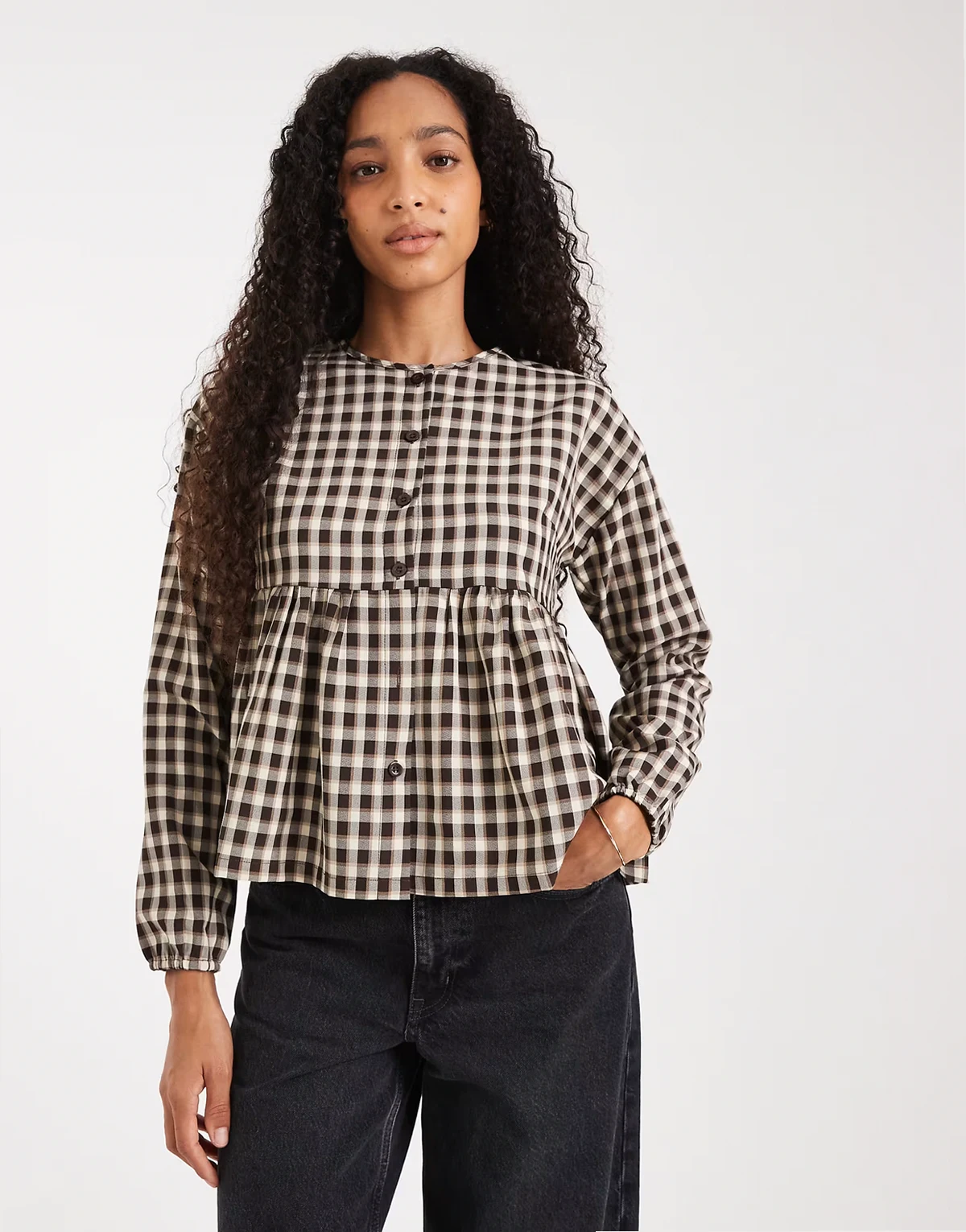 button down long sleeve blouse with peplum hem in brown gingham
