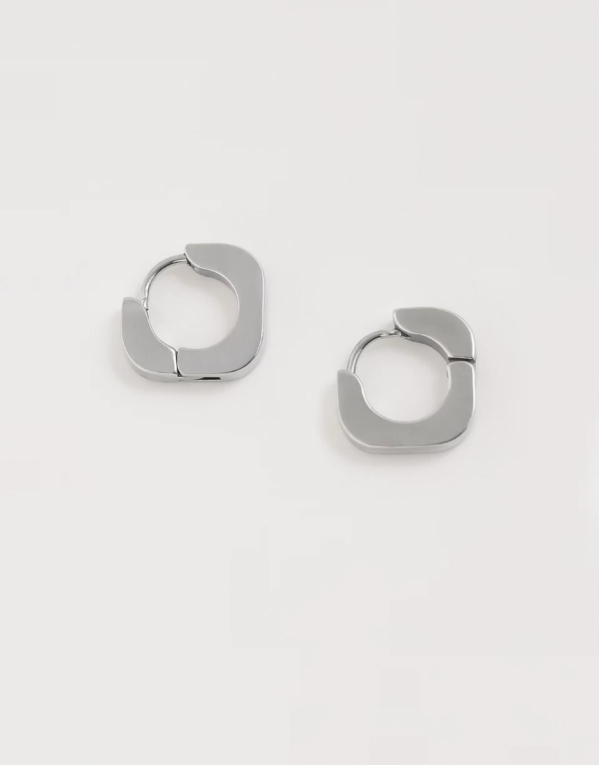 waterproof stainless steel rounded edge square huggie hoop earrings in silver