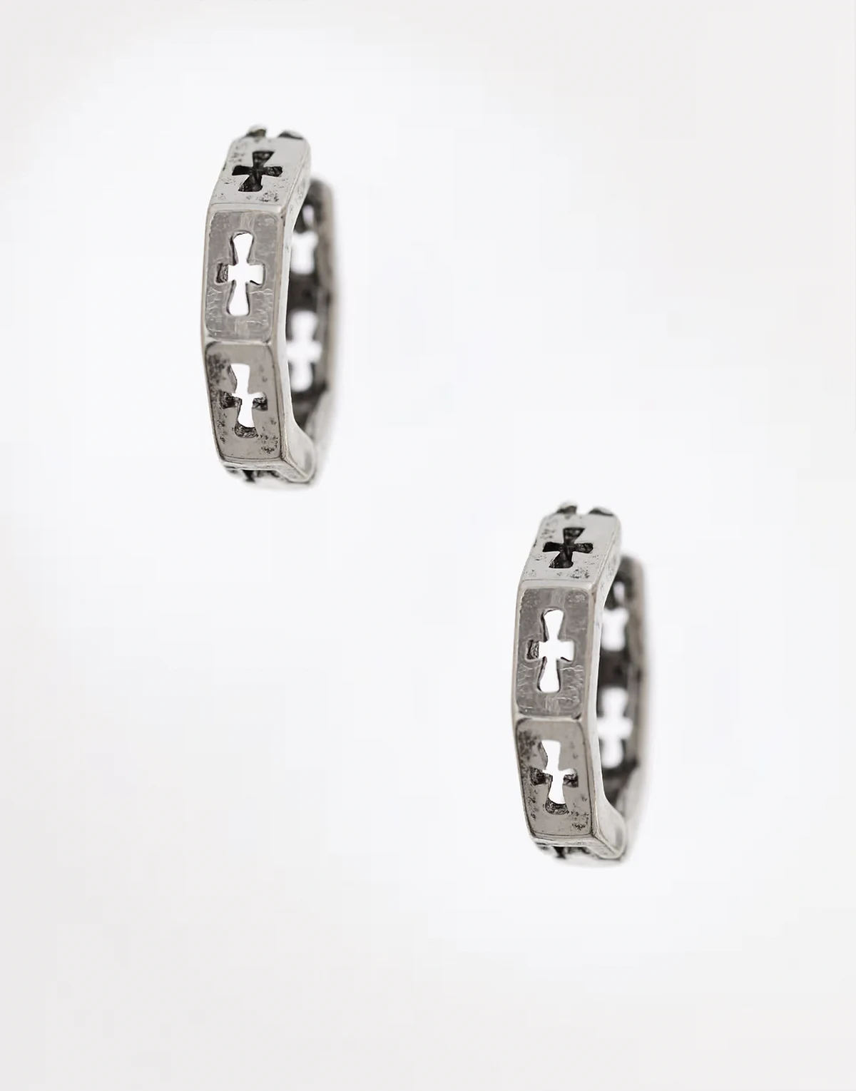 hexagon huggie hoop earrings with cut out cross details in silver
