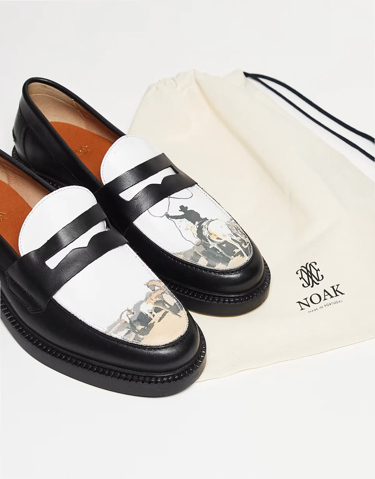 made in Portugal penny loafers in black and white leather with print