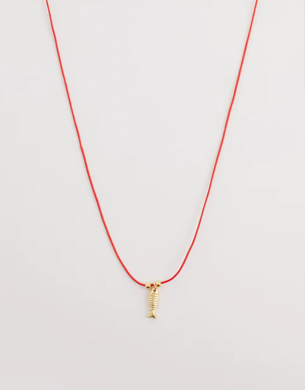 fish pendant cord necklace in red and 18kt gold vermeil