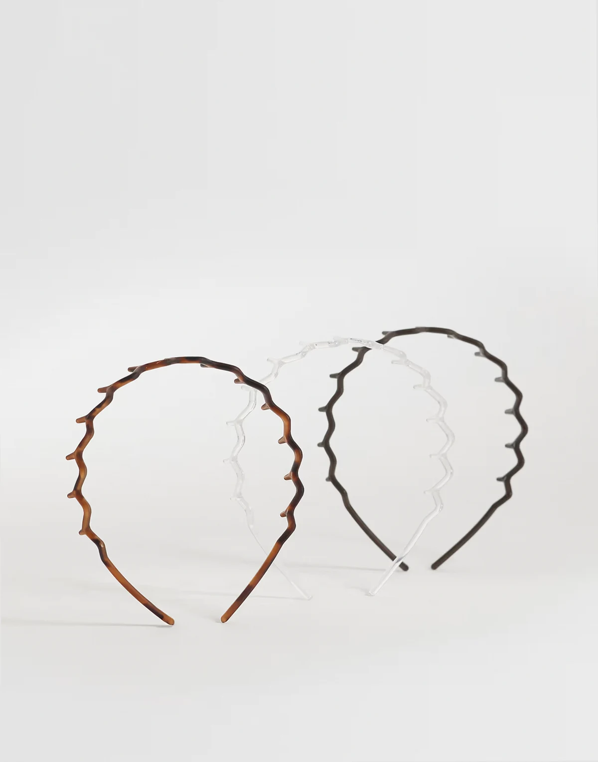 3-pack zig-zag hairbands in black, brown and clear